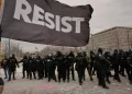 Protesters gather near federal building during Minneapolis immigration protests - AP Photo/John Locher