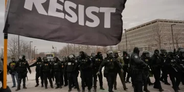 Protesters gather near federal building during Minneapolis immigration protests - AP Photo/John Locher