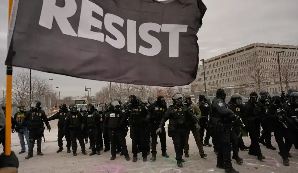Protesters gather near federal building during Minneapolis immigration protests - AP Photo/John Locher