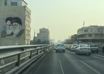 Iranian protesters face security forces during nationwide unrest - AP Photo/Vahid Salemi
