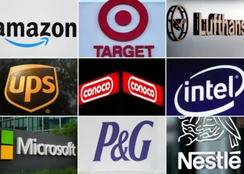 Workers react to major company layoffs across multiple industries - AP Photo, File