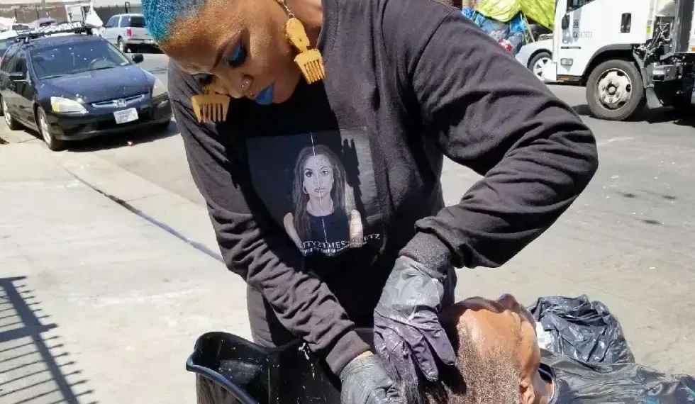 Shirley Raines serving food to unhoused people on Skid Row - Melissa Acedera via AP