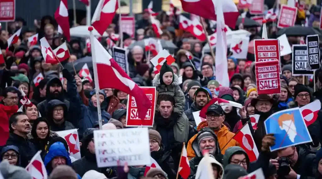 Trump speaks as Greenland and European flags appear behind him - AP Photo/Evgeniy Maloletka