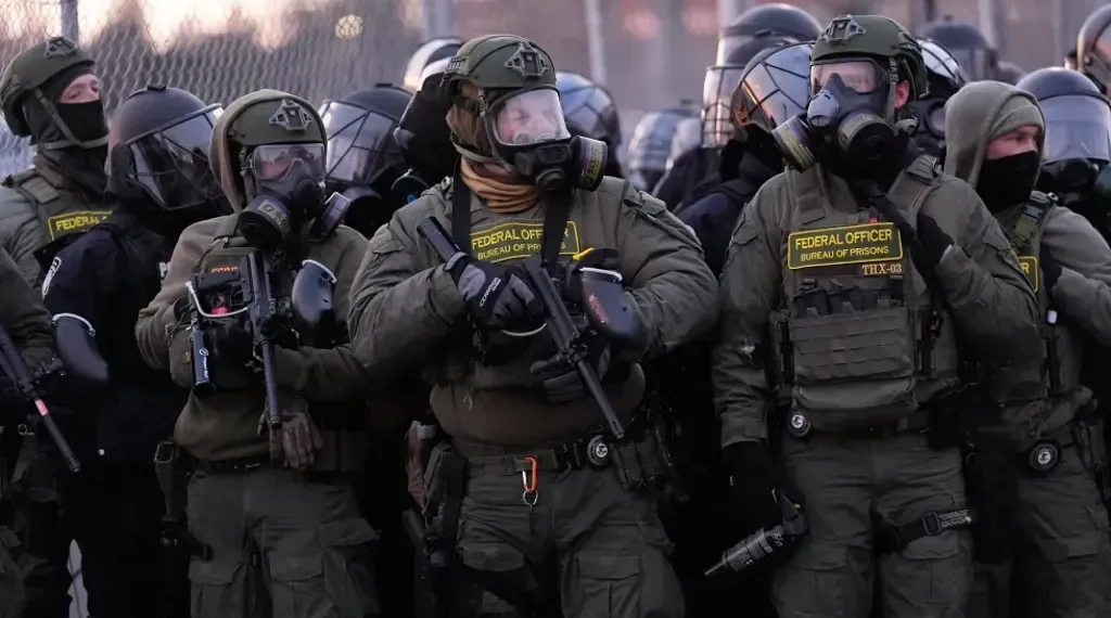 Federal immigration officers during expanded ICE enforcement operation - AP Photo/Yuki Iwamura