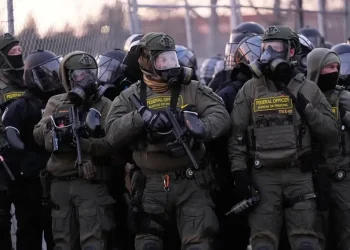 Federal immigration officers during expanded ICE enforcement operation - AP Photo/Yuki Iwamura