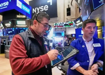 US stocks trade higher as gold prices hit a record - AP Photo/Richard Drew