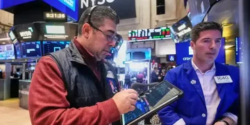 US stocks trade higher as gold prices hit a record - AP Photo/Richard Drew