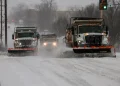 Snow-covered airport runway during U.S. winter storm disruptions - Mike Simons/Tulsa World via AP