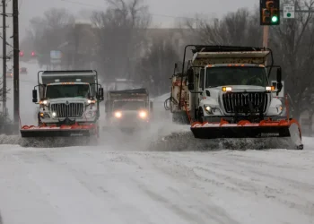 Snow-covered airport runway during U.S. winter storm disruptions - Mike Simons/Tulsa World via AP