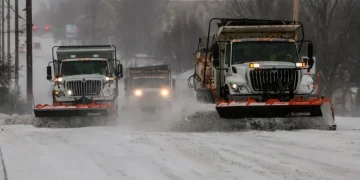 Snow-covered airport runway during U.S. winter storm disruptions - Mike Simons/Tulsa World via AP