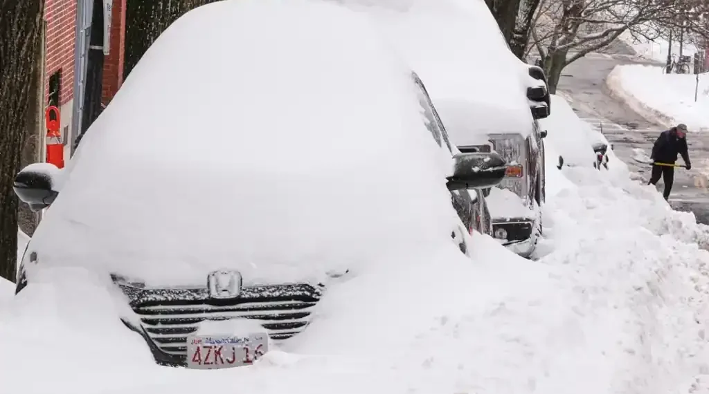 Snow-covered US city during deadly winter storm and power outages - AP Photo/Charles Krupa