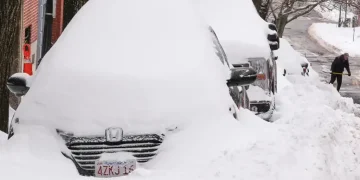Snow-covered US city during deadly winter storm and power outages - AP Photo/Charles Krupa