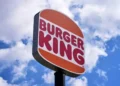 Burger King employee wearing AI headset in restaurant kitchen - AP Photo/Gene J. Puskar, File