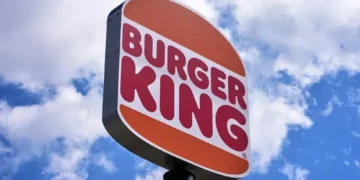 Burger King employee wearing AI headset in restaurant kitchen - AP Photo/Gene J. Puskar, File