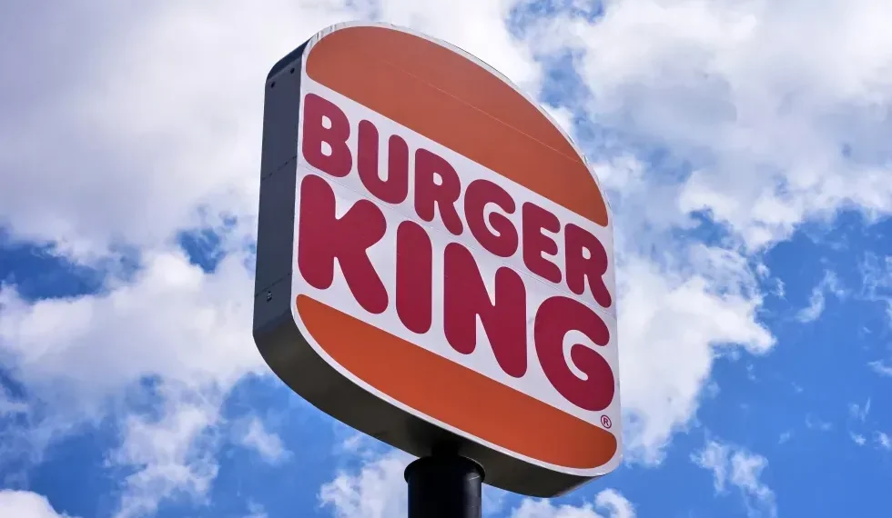 Burger King employee wearing AI headset in restaurant kitchen - AP Photo/Gene J. Puskar, File