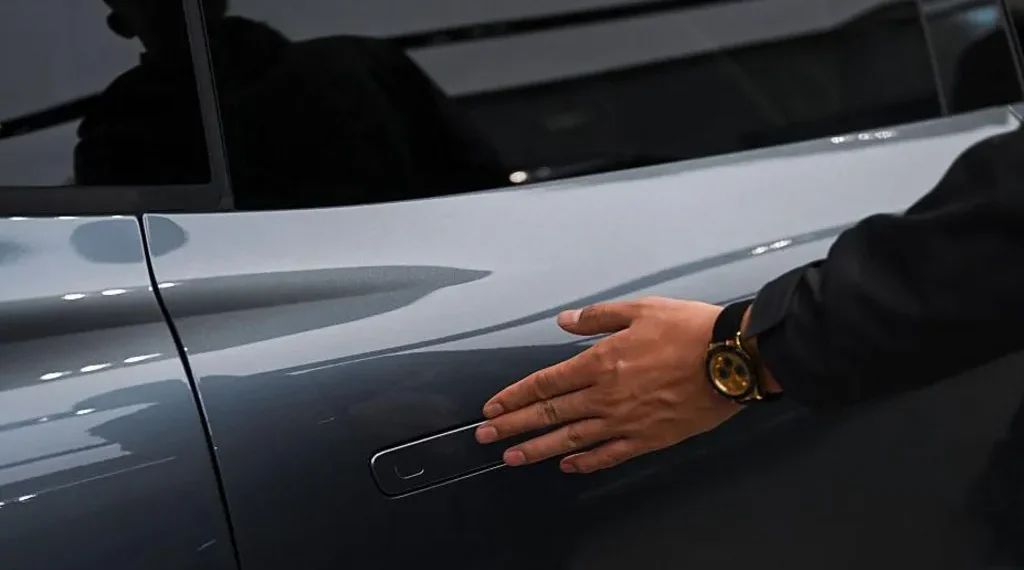Electric vehicle with standard exterior door handles in China - AFP via Getty Images