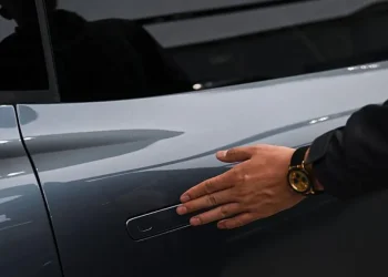 Electric vehicle with standard exterior door handles in China - AFP via Getty Images