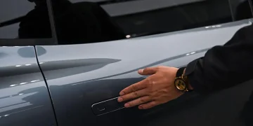 Electric vehicle with standard exterior door handles in China - AFP via Getty Images