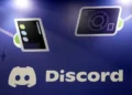 Discord app logo displayed on smartphone screen - AP Photo/Jeff Chiu, File