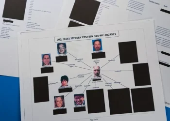 Stacks of redacted Epstein investigation files released by Justice Department - AP Photo/Jon Elswick