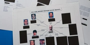 Stacks of redacted Epstein investigation files released by Justice Department - AP Photo/Jon Elswick