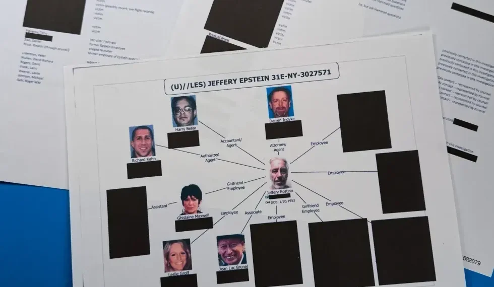 Stacks of redacted Epstein investigation files released by Justice Department - AP Photo/Jon Elswick