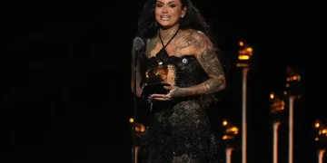 Artists wearing ICE OUT protest pins on Grammys red carpet 2026 - AP Photo/Chris Pizzello