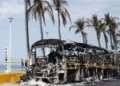 Burned vehicles on highway after Guadalajara cartel violence - EPA/BBC