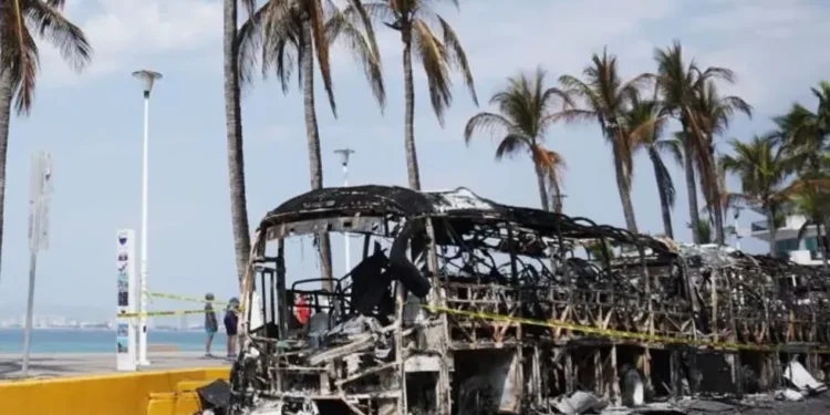 Burned vehicles on highway after Guadalajara cartel violence - EPA/BBC
