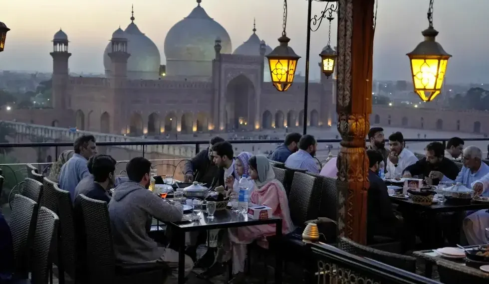 Traditional Ramadan iftar meal with dates and water - AP Photo/K.M. Chaudary, File