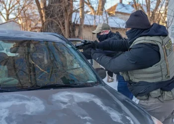 Armed immigration agents detain activists in south Minneapolis street operation - AP Photo/Ryan Murphy