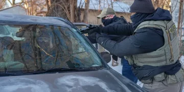 Armed immigration agents detain activists in south Minneapolis street operation - AP Photo/Ryan Murphy