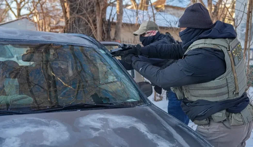 Armed immigration agents detain activists in south Minneapolis street operation - AP Photo/Ryan Murphy
