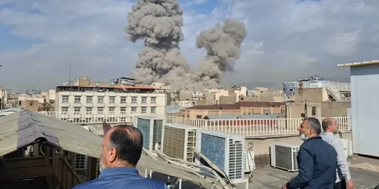 Smoke rises over Tehran after Israeli strike - AP Photo