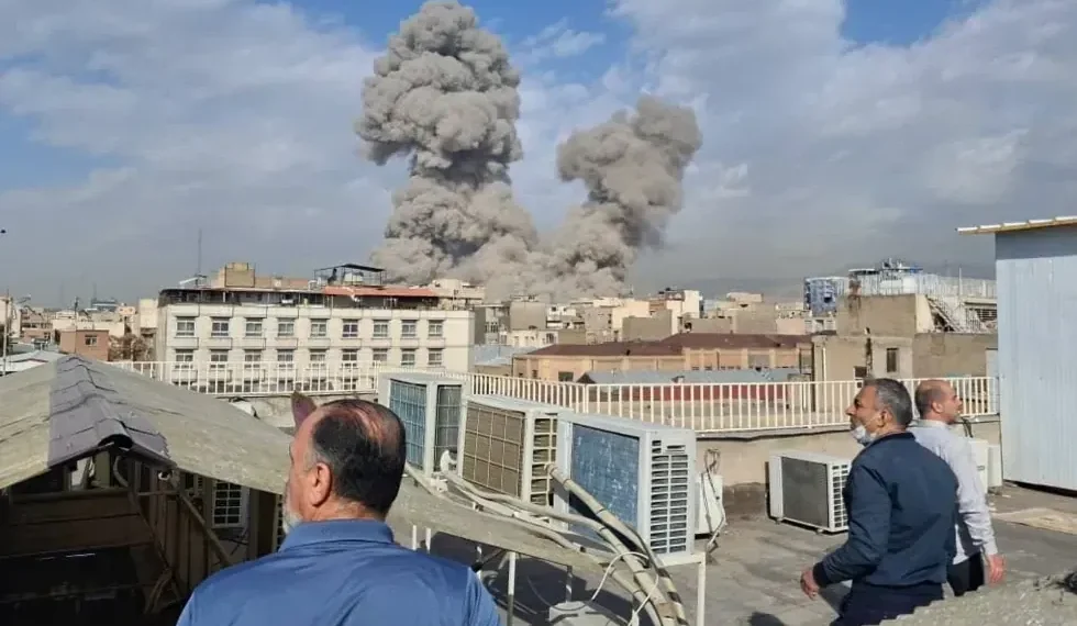 Smoke rises over Tehran after Israeli strike - AP Photo