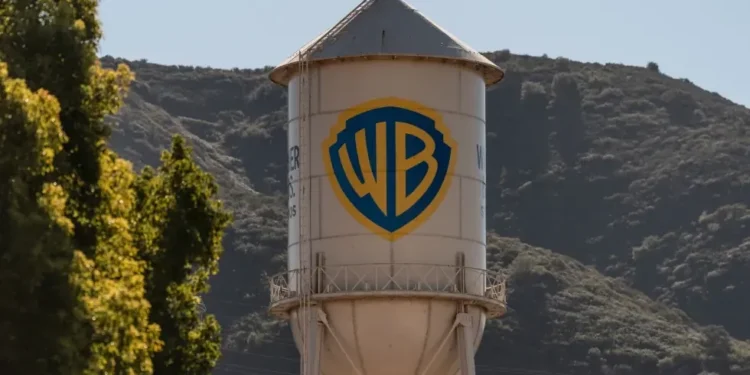 Netflix and Warner Bros logos amid takeover battle - AP Photo/Jae C hong, File