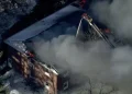 Flames and smoke rise from a collapsed Nashua mental health facility - WCVB-TV via AP