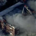 Flames and smoke rise from a collapsed Nashua mental health facility - WCVB-TV via AP