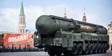 U.S. and Russian flags behind symbolic nuclear missile silhouettes - Alexander Nemenov/AFP/Getty Images