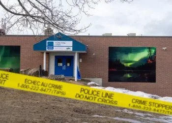 OpenAI logo and RCMP investigation in Canada - Christinne Muschi/The Canadian Press via AP