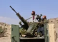 Pakistani and Afghan border forces after cross-border strikes - AP Photo/Saifullah Zahir