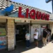 Powerball lottery ticket and jackpot display board - Damian Dovarganes /AP Photo, File