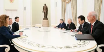 Vladimir Putin at Kremlin meeting on Ukraine talks - Kristina Kormilitsyna/Reuters/CNN
