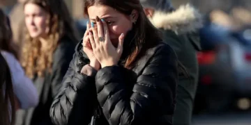 Police vehicles outside Pawtucket hockey arena after shooting - AP Photo/Mark Stockwell
