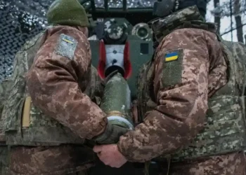 Ukrainian soldiers in trench amid drone surveillance- AP Photo/Andrii Marienko, File