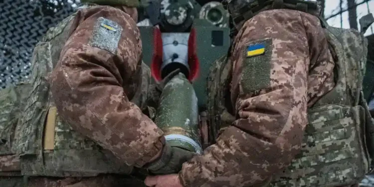 Ukrainian soldiers in trench amid drone surveillance- AP Photo/Andrii Marienko, File