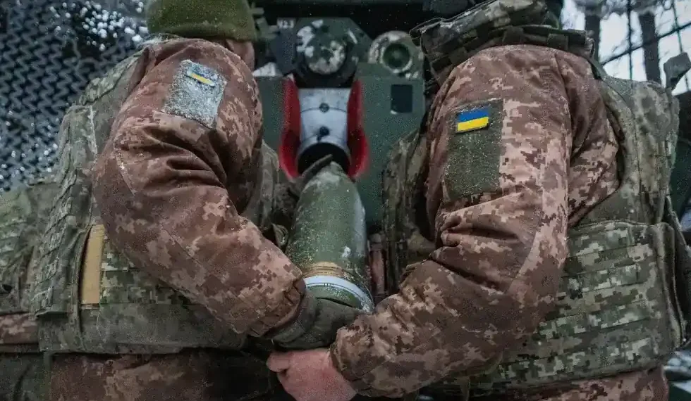 Ukrainian soldiers in trench amid drone surveillance- AP Photo/Andrii Marienko, File
