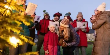 Community choir singing together in rehearsal space - Getty Images/BBC