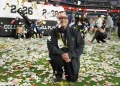 Confetti falling over players celebrating on Super Bowl field - AP Photo/Rebecca Blackwell