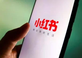 Xiaohongshu app logo displayed on smartphone screen in Taiwan - VCG/AP